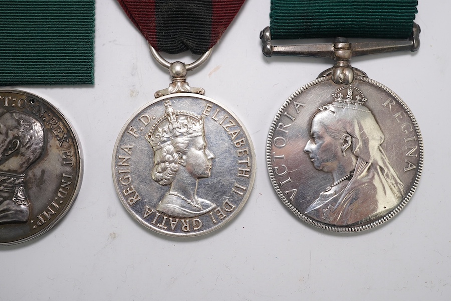 Four assorted Service medals; Vict unnamed Volunteer Long Service medal; GV Colonial Auxiliary Forces Long Service medal (disc only) to E.S.Ware; ERII ISM to Thomas Edward Downes; ERII ISM to William Henry Sharratt. Cond